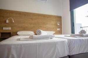 Cama ou camas em um quarto em Julipapas Gardens
