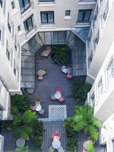 an overhead view of a courtyard in a building at Hotel Eiffel Blomet in Paris