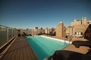 a swimming pool on the roof of a building at ARC Abasto Studios in Buenos Aires