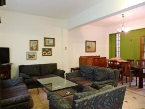 a living room with two couches and a table at Stamatina's House in Athens