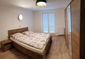 Postel nebo postele na pokoji v ubytování Apartmán U Labe