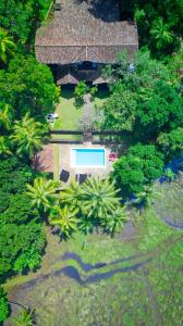 an overhead view of a house with a swimming pool at Galle Henna Estate in Unawatuna