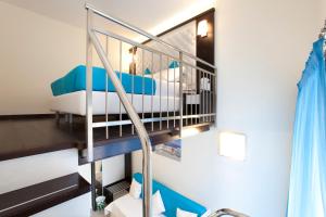 a bunk bed in a room with a staircase at Sorrento Flats in Sorrento