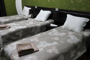 Postel nebo postele na pokoji v ubytování Hotel Zarafshon in Dushanbe