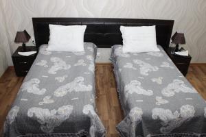Postel nebo postele na pokoji v ubytování Hotel Zarafshon in Dushanbe