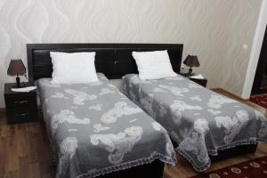 Postel nebo postele na pokoji v ubytování Hotel Zarafshon in Dushanbe