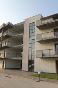 an apartment building with balconies on the side of it at Case Così Apartments - Verona in Verona