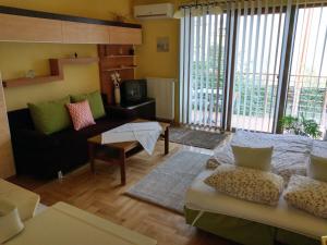 Postel nebo postele na pokoji v ubytování Mandarin Wellness Apartman