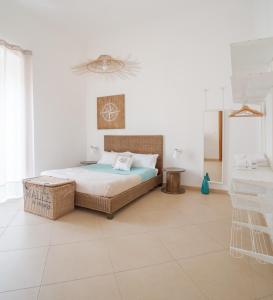 Ένα ή περισσότερα κρεβάτια σε δωμάτιο στο Isola Blu