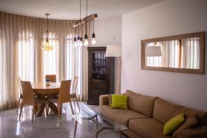 
a living room filled with furniture and a window at Exodus Hostel & Dive Center in Eilat

