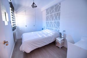 Кровать или кровати в номере Cuencaloft El Mirador del Gallo