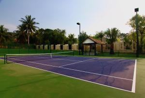 a tennis court with a gazebo and a tennis at Tamarind Exclusive Villa in Bang Sare