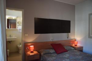 TV a/nebo společenská místnost v ubytování Albergo Al Pescatore