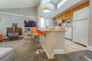 a kitchen with a refrigerator and a stove at Gold Camp Gold Pan Condo: On Shuttle Route in Breckenridge +23 photos