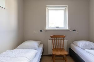 Un pat sau paturi într-o cameră la T Fiskersplak