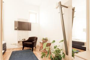 TV a/nebo společenská místnost v ubytování Denner Hotel