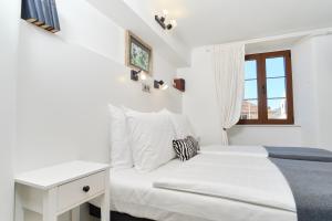 Postel nebo postele na pokoji v ubytování Apartments Zebra