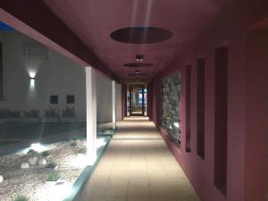 a hallway of a building with a purple ceiling at Garden 33 in Chivilcoy