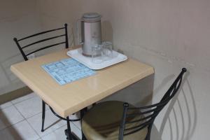 a table with a blender on top of it at Elegant Circle Inn in Cebu City
