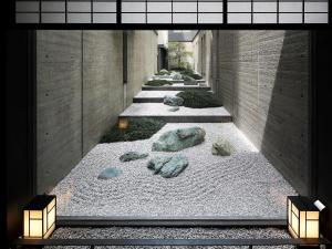 a hallway with rocks on the floor of a building at Hotel Vista Premio Kyoto Nagomi tei in Kyoto