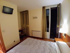 Postel nebo postele na pokoji v ubytování Hostal Prada Borges