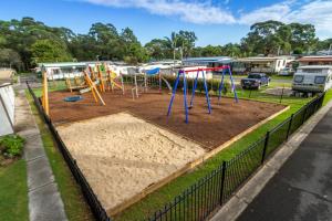 a sandbox with a playground in a park at Ingenia Holidays Shoalhaven Heads in Shoalhaven Heads