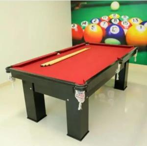 a pool table with two cuesticks on top of it at Condomínio Solaris residencial Club in Ilhéus