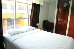 Postel nebo postele na pokoji v ubytování Hotel Plaza Sullana