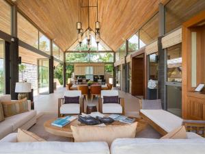 a living room with a couch and a table at Panacea Retreat in Bophut 