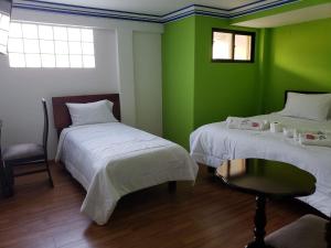 Кровать или кровати в номере Azul Real