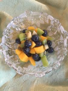 a glass bowl filled with fruit on top of a table at Hardeman House Bed and Breakfast in Nacogdoches