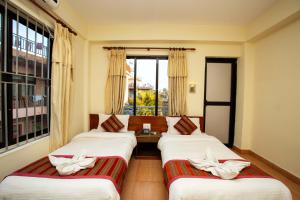Ένα ή περισσότερα κρεβάτια σε δωμάτιο στο Hotel Orchid