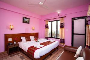 Ένα ή περισσότερα κρεβάτια σε δωμάτιο στο Hotel Orchid