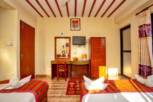 Ένα ή περισσότερα κρεβάτια σε δωμάτιο στο Hotel Orchid