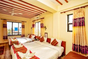 Ένα ή περισσότερα κρεβάτια σε δωμάτιο στο Hotel Orchid