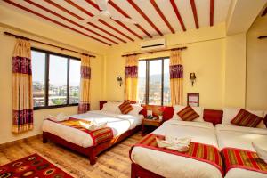Ένα ή περισσότερα κρεβάτια σε δωμάτιο στο Hotel Orchid