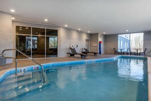 a large swimming pool in a hotel room at Cambria Hotel West Orange in West Orange