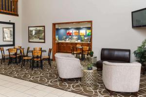 a restaurant with chairs and tables and a bar at Quality Inn Burlington near Hwy 34 in Burlington