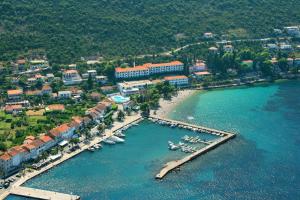 an aerial view of a beach with boats in the water at Hotel Faraon in Trpanj