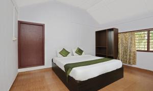 Postel nebo postele na pokoji v ubytování Itsy Hotels Jammabane Cottage