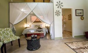 Voodi või voodid majutusasutuse Nguni Lodge toas