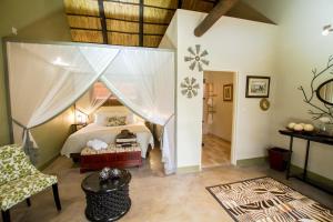 Voodi või voodid majutusasutuse Nguni Lodge toas