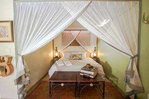 Voodi või voodid majutusasutuse Nguni Lodge toas