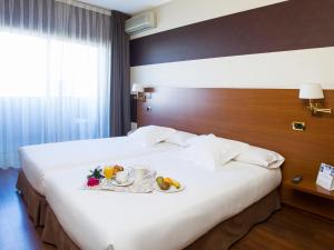 Łóżko lub łóżka w pokoju w obiekcie Oca Ipanema Hotel