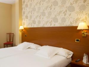 Łóżko lub łóżka w pokoju w obiekcie Oca Ipanema Hotel