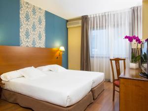 Łóżko lub łóżka w pokoju w obiekcie Oca Ipanema Hotel