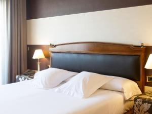 Łóżko lub łóżka w pokoju w obiekcie Oca Ipanema Hotel