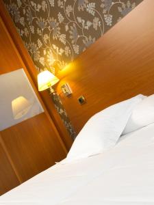 Łóżko lub łóżka w pokoju w obiekcie Oca Ipanema Hotel