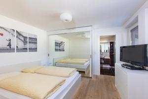 Cama ou camas em um quarto em Appartements Buggl's