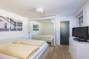 Cama ou camas em um quarto em Appartements Buggl's